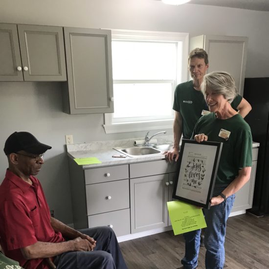 Mr Willie presented with a wall hanging for his kitchen