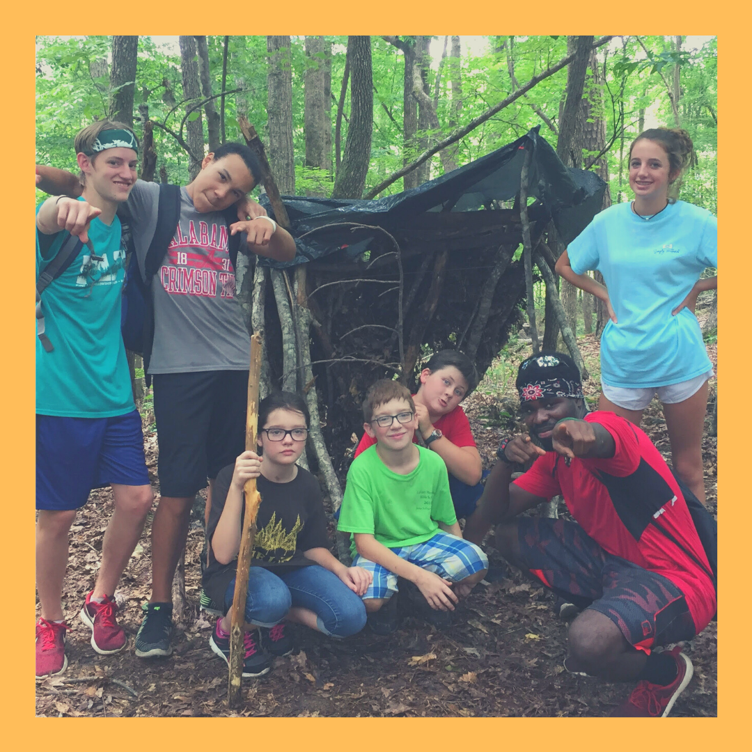 Campers with the shelter they built